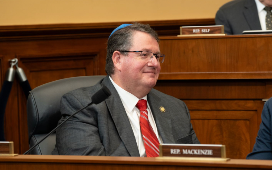 Congressman Fine sits at a Congressional hearing.